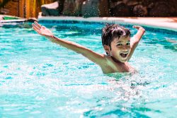 Young,Boy,Kid,Child,Eight,Years,Old,Splashing,In,Swimming