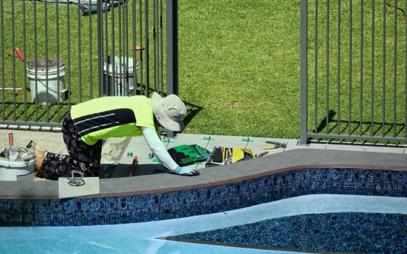 Outdoor,Floor,Tiling,Around,A,Pool,In,Progress,With,All