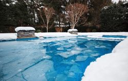 Pool,With,Ice,And,Slush,After,Snow,Storm.,Inground,Pool