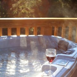 Steaming,Hot,Tub,On,The,Deck,With,Wine,Glass